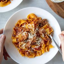 Slow Cooker Beef Ragu in a white bowl with a fork