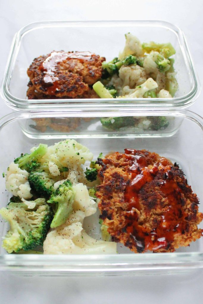 Tuna cakes with Sweet Chili sauce on them in a meal per container with broccoli