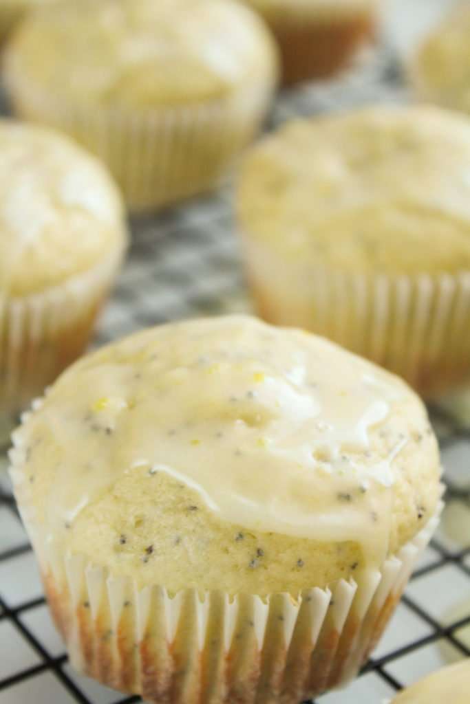 Extra Lemony Poppy Seed Muffins on a cooling rack. 