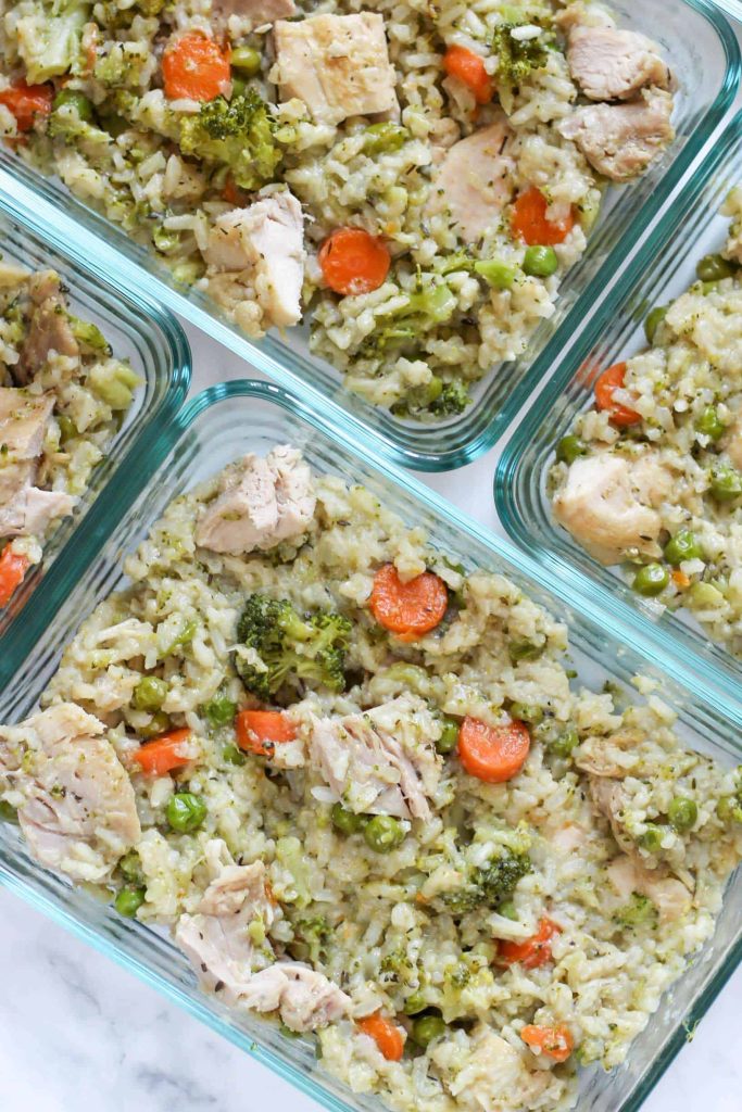 Chicken and Rice- Half cauliflower rice, half long-grain rice.. In a meal prep container.