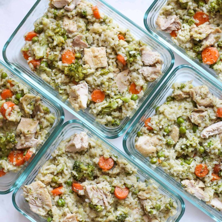 Chicken and Rice- Half cauliflower rice, half long-grain rice.. In a meal prep container.