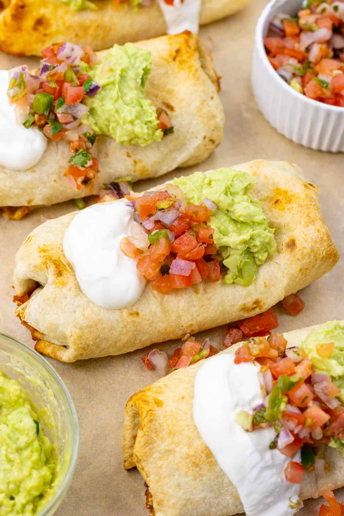 Chicken chimichangas with toppings
