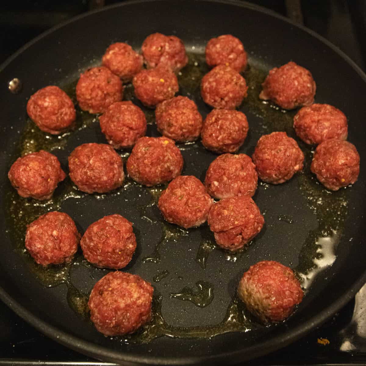 Meatballs Cooking in a skillet