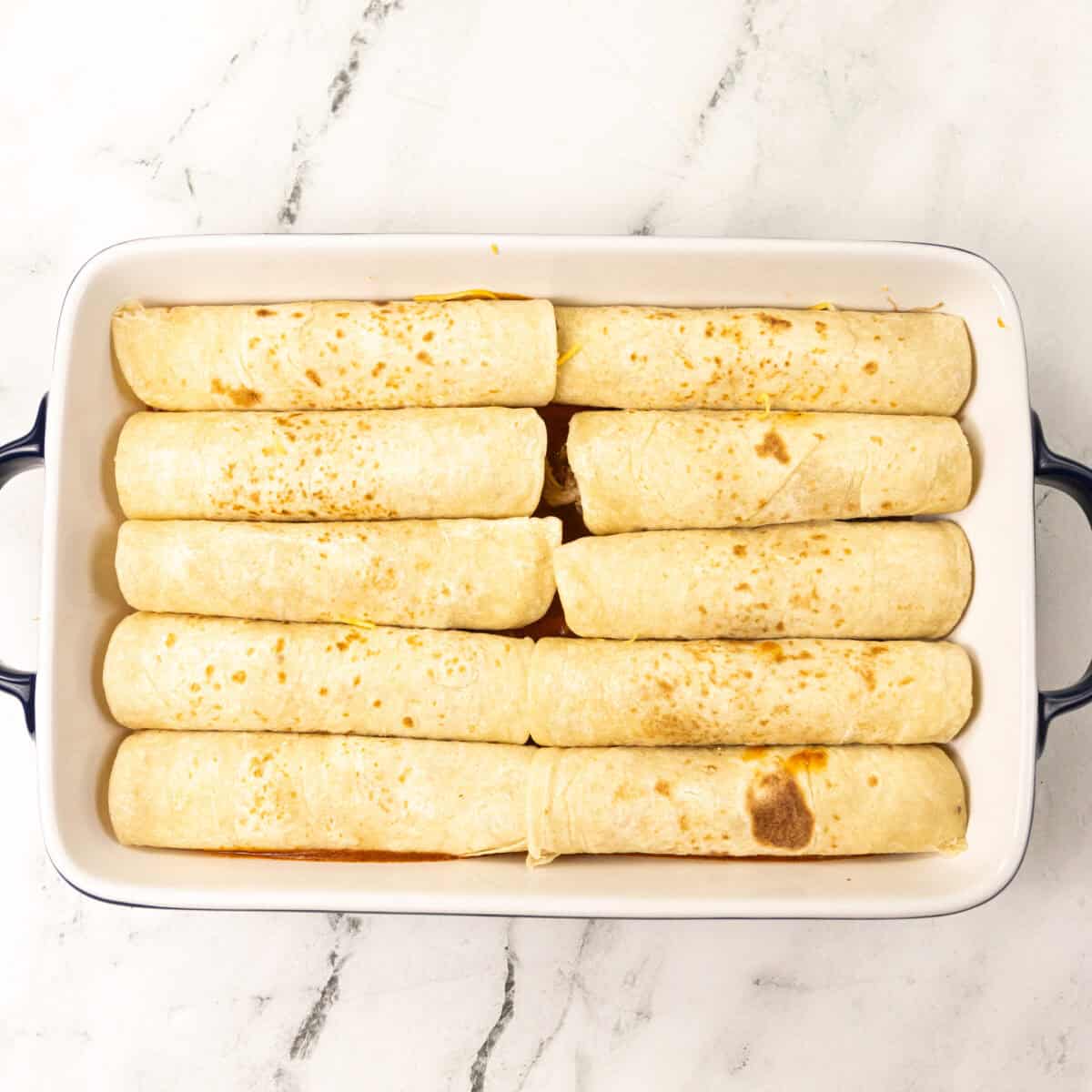enchiladas assembled on pan