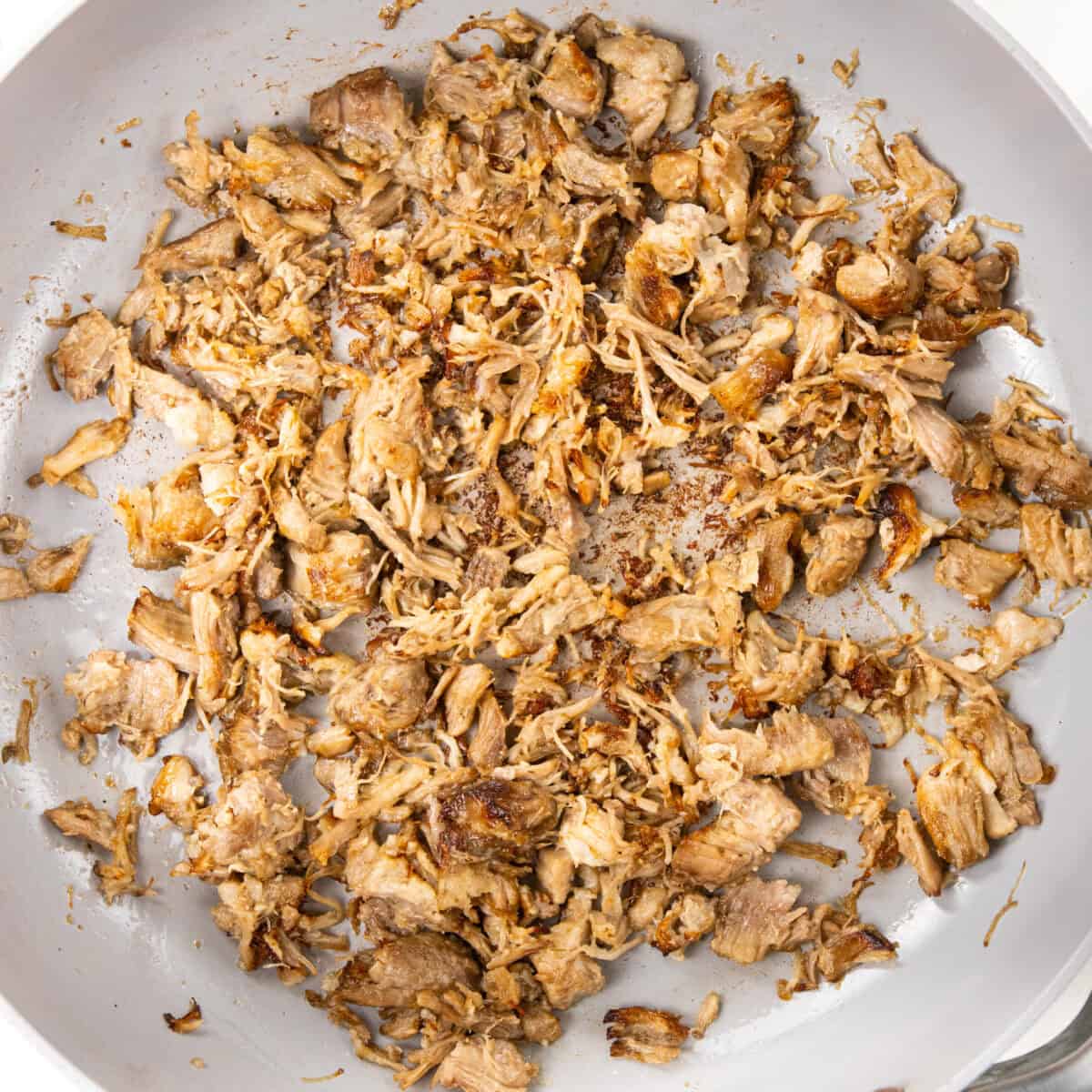 warming up pulled pork for Pulled Pork Carnitas Quesadilla Recipe