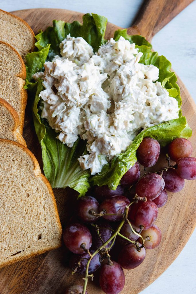Chicken Salad in lettus with grapes and bread around it