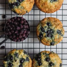 Banana Blueberry Muffins on a black cooling rack.