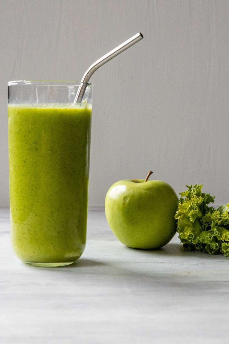 Apple Kale Smoothie with kale and an apple in the background
