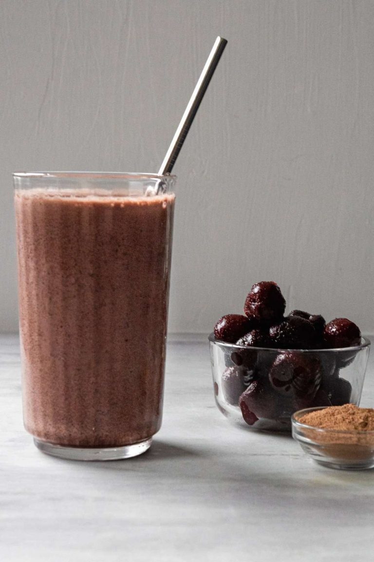 Chocolate Cherry Smoothie with cherries in the back ground