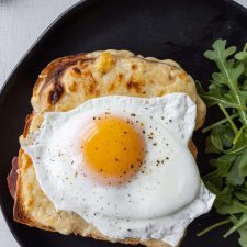 Croque Madame Sandwich with a side salad