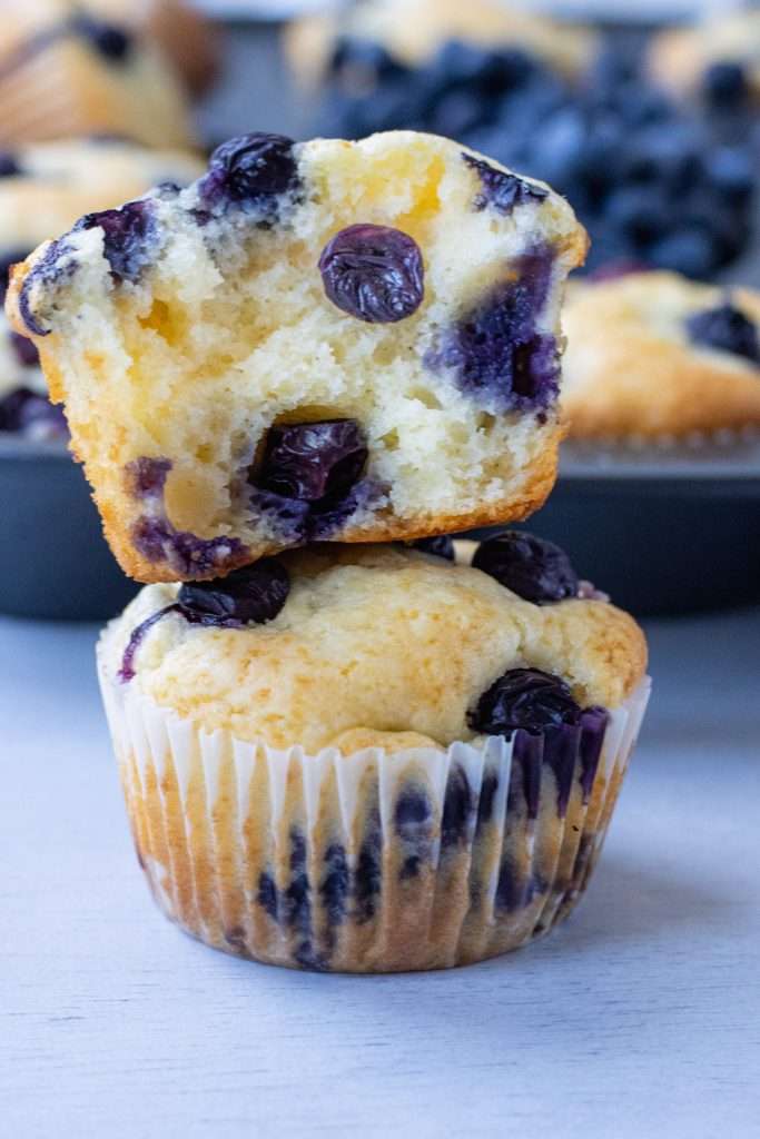 Sour Cream Blueberry Muffins stack on eachother