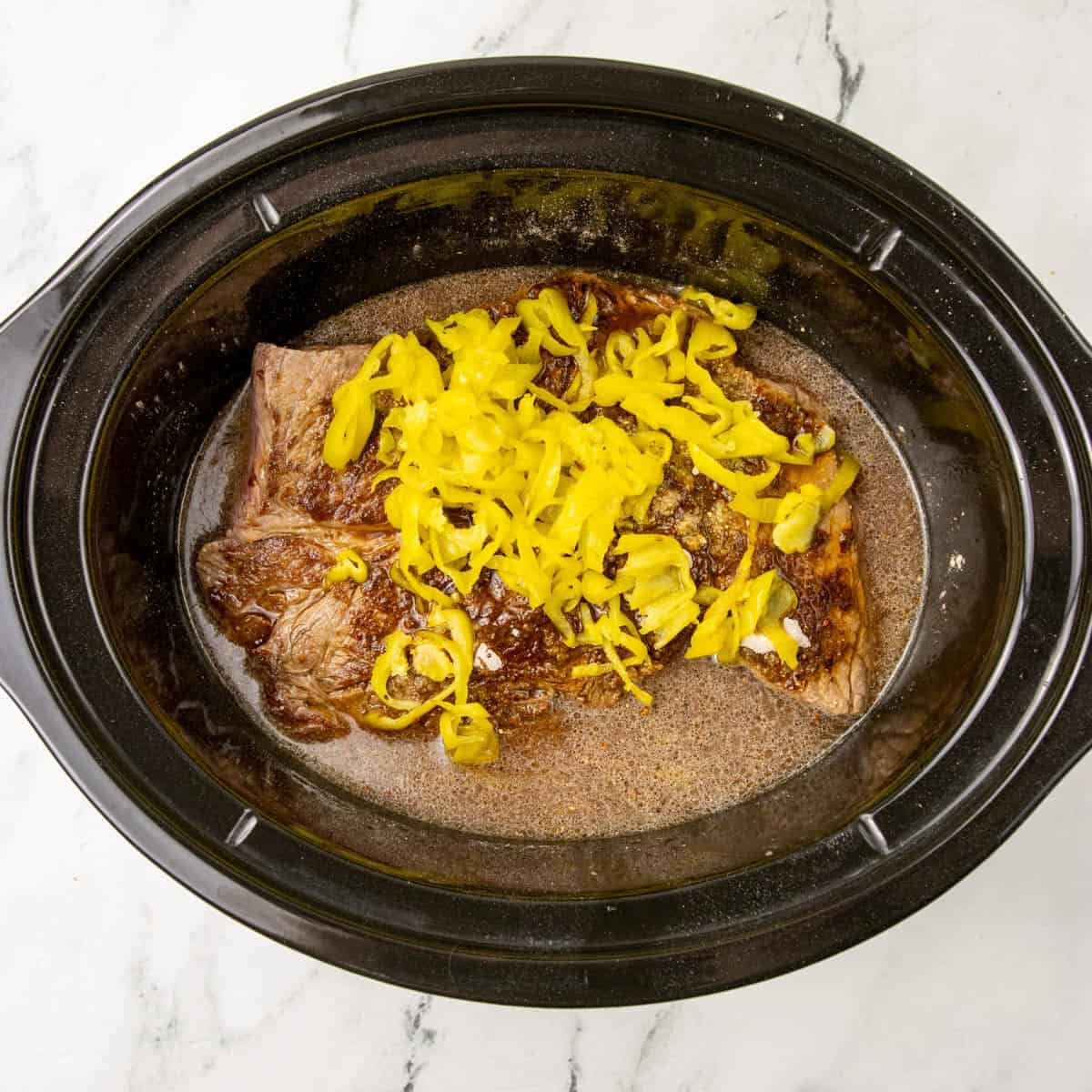 Ingredients for Italian Beef Sandwiches in in slow cooker