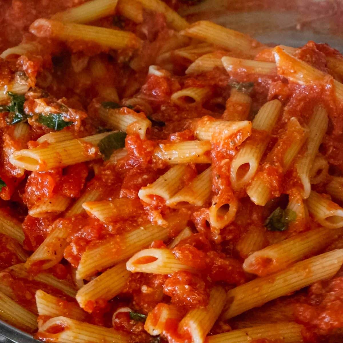 pasta mixed into sauce