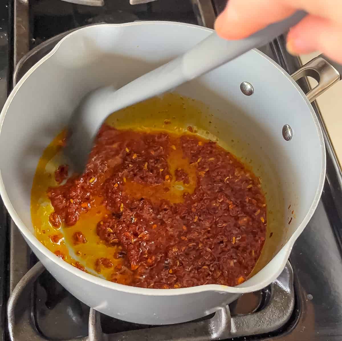 cook tomato paste in olive oil