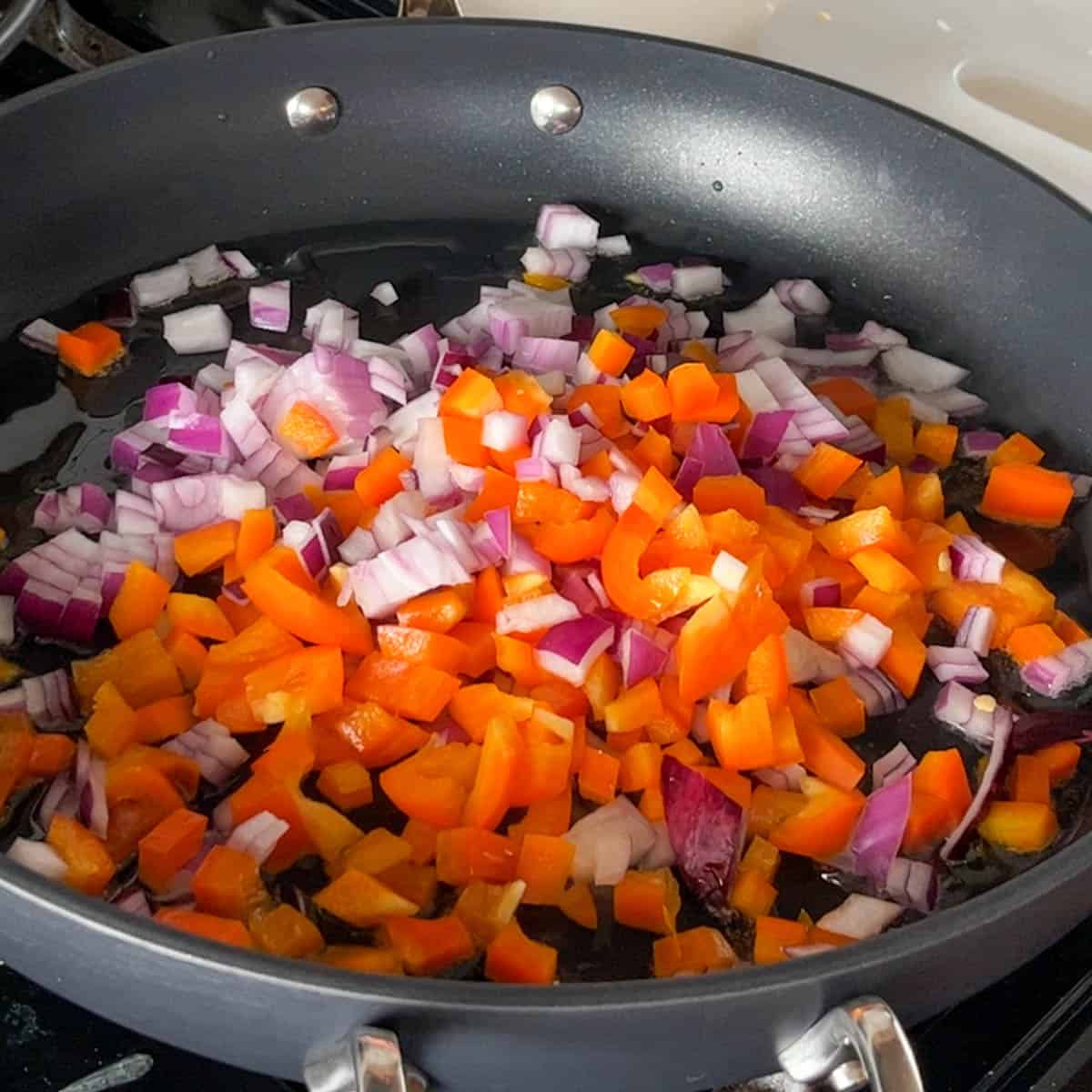 bell pepper and inion in a skillet