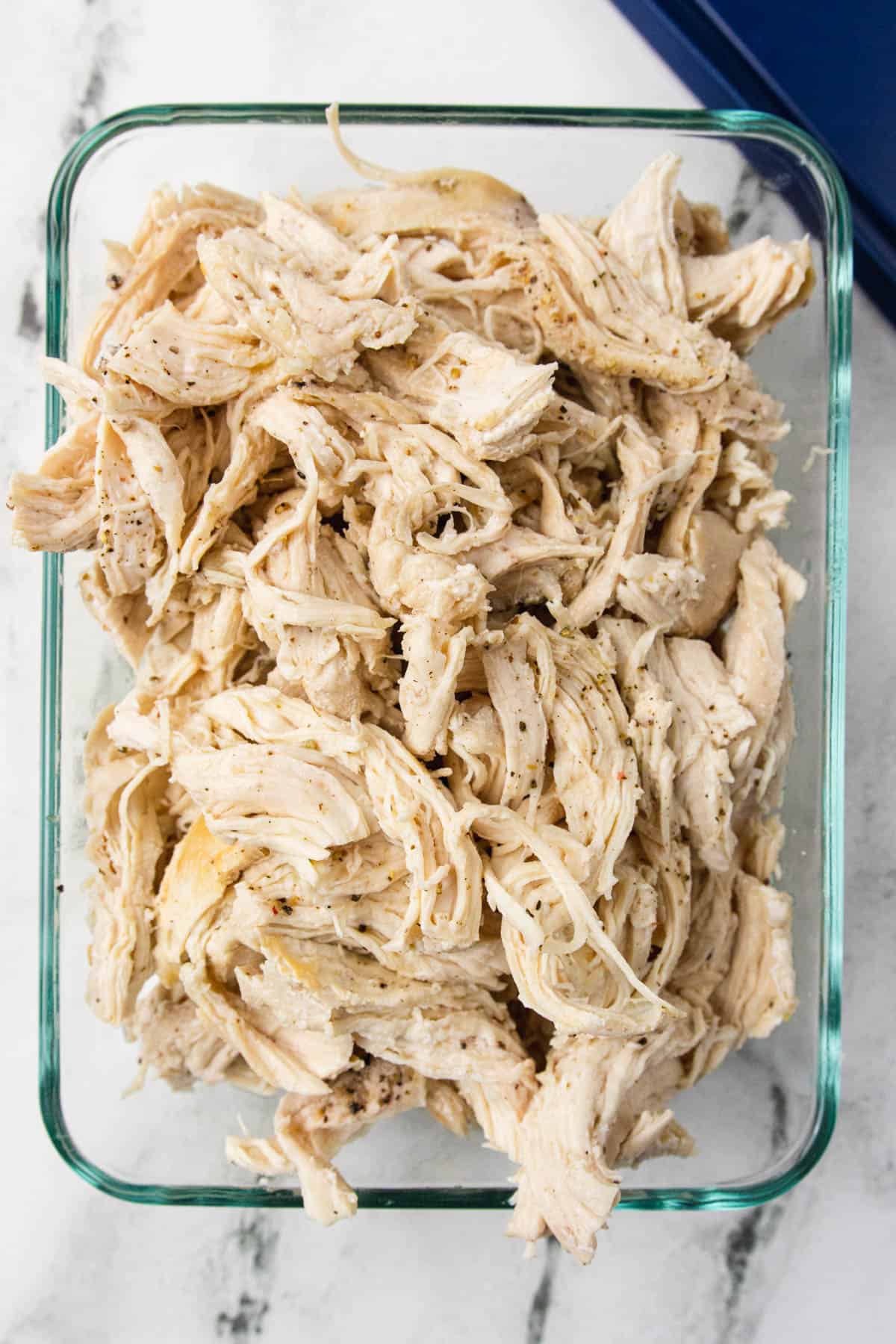 shredded chicken in a glass container