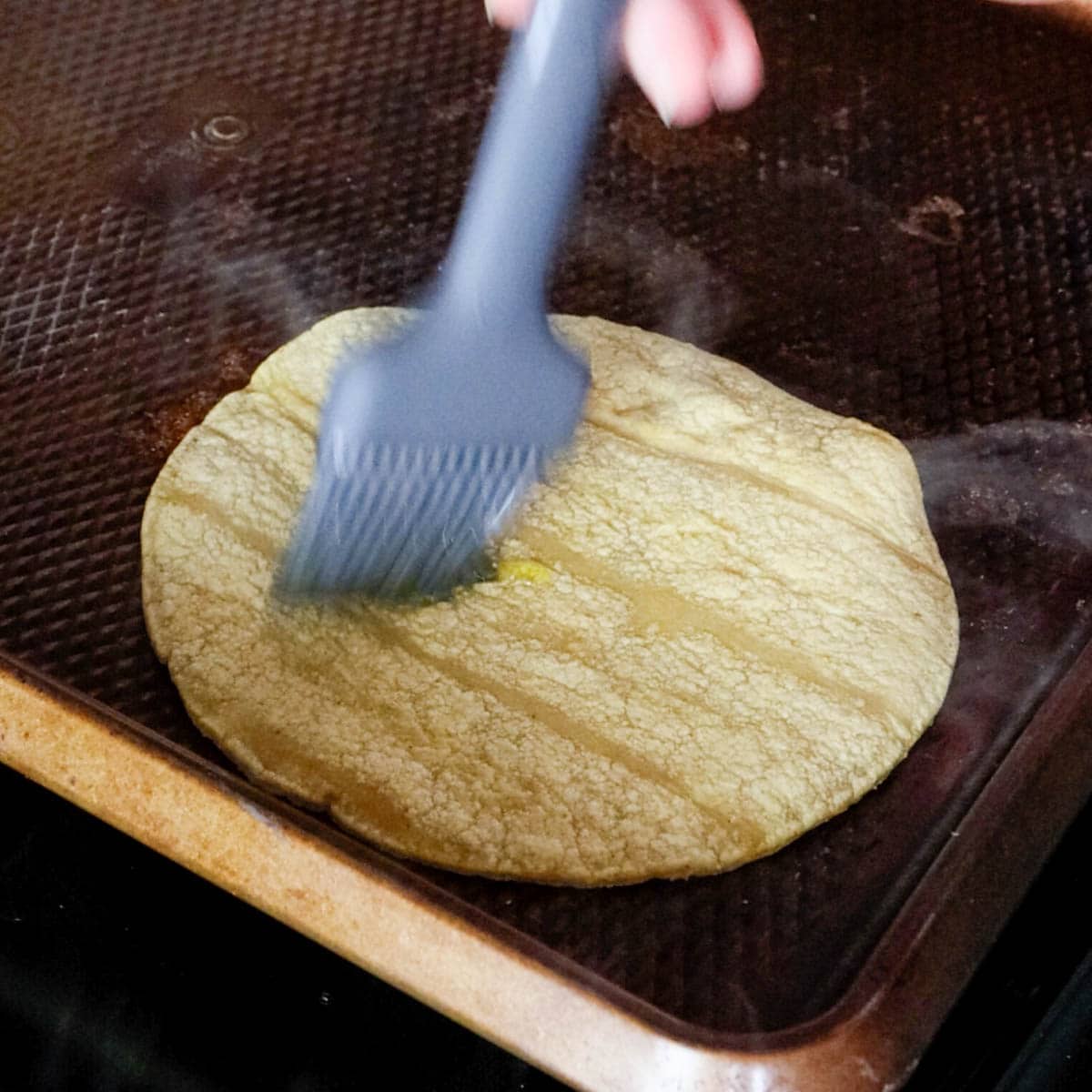 brushing oil on to tortilla