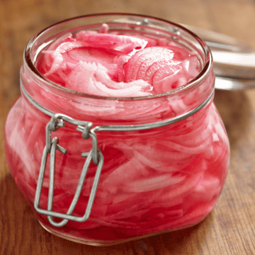 pickled red onions in a jar