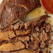 BBQ beef brisket sliced with bbq next to it