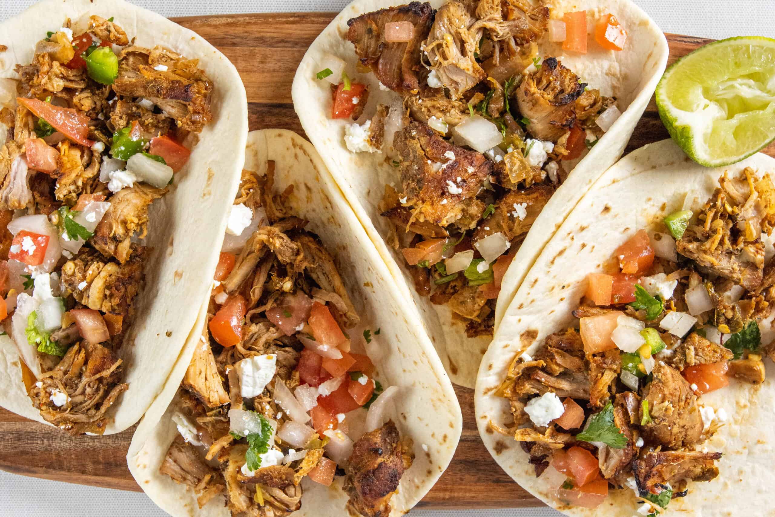 Carnitas Tacos on a board