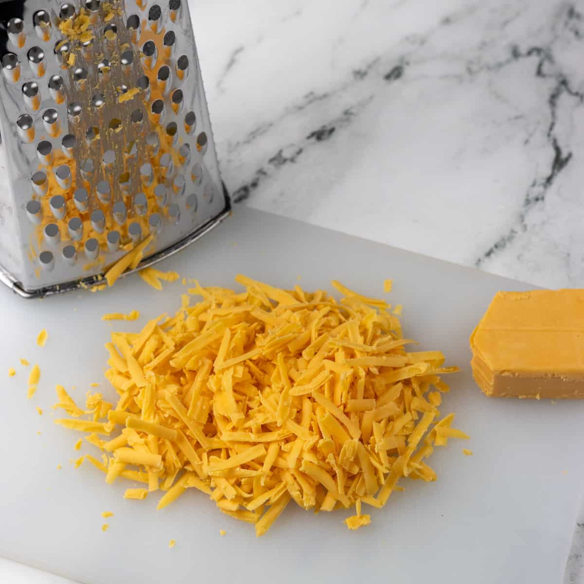 Shredded cheese with a grater