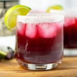 Hibiscus Margarita with a lime wedge