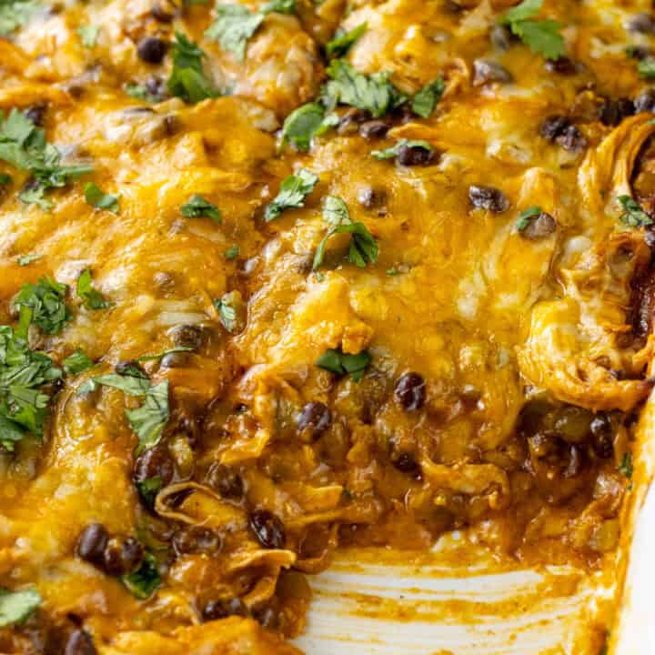 a piece cut out of the Chicken Enchilada Casserole