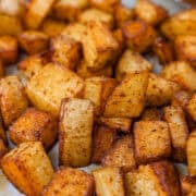 Finished seasoned potatoes laying on a pan