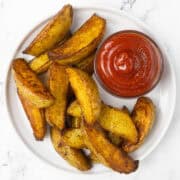 Potato Wedges and Ketchup on plate