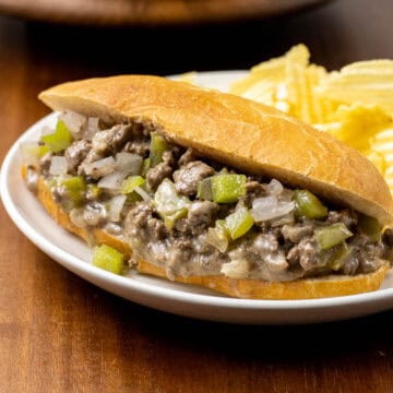 Ground Beef Philly Cheese Steak on a plate with chips