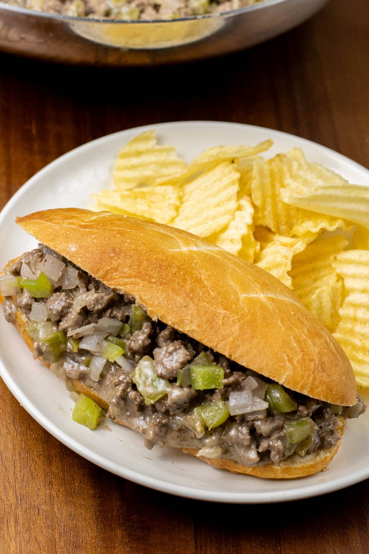 Ground Beef Philly Cheese Steak on a plate with chips