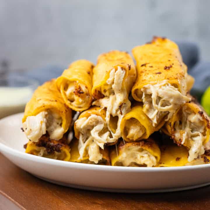 Creamy Chicken Taquitos stacked and ready to eat