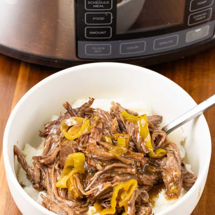 Crockpot Mississippi Pot Roast serve with mashed potatoes