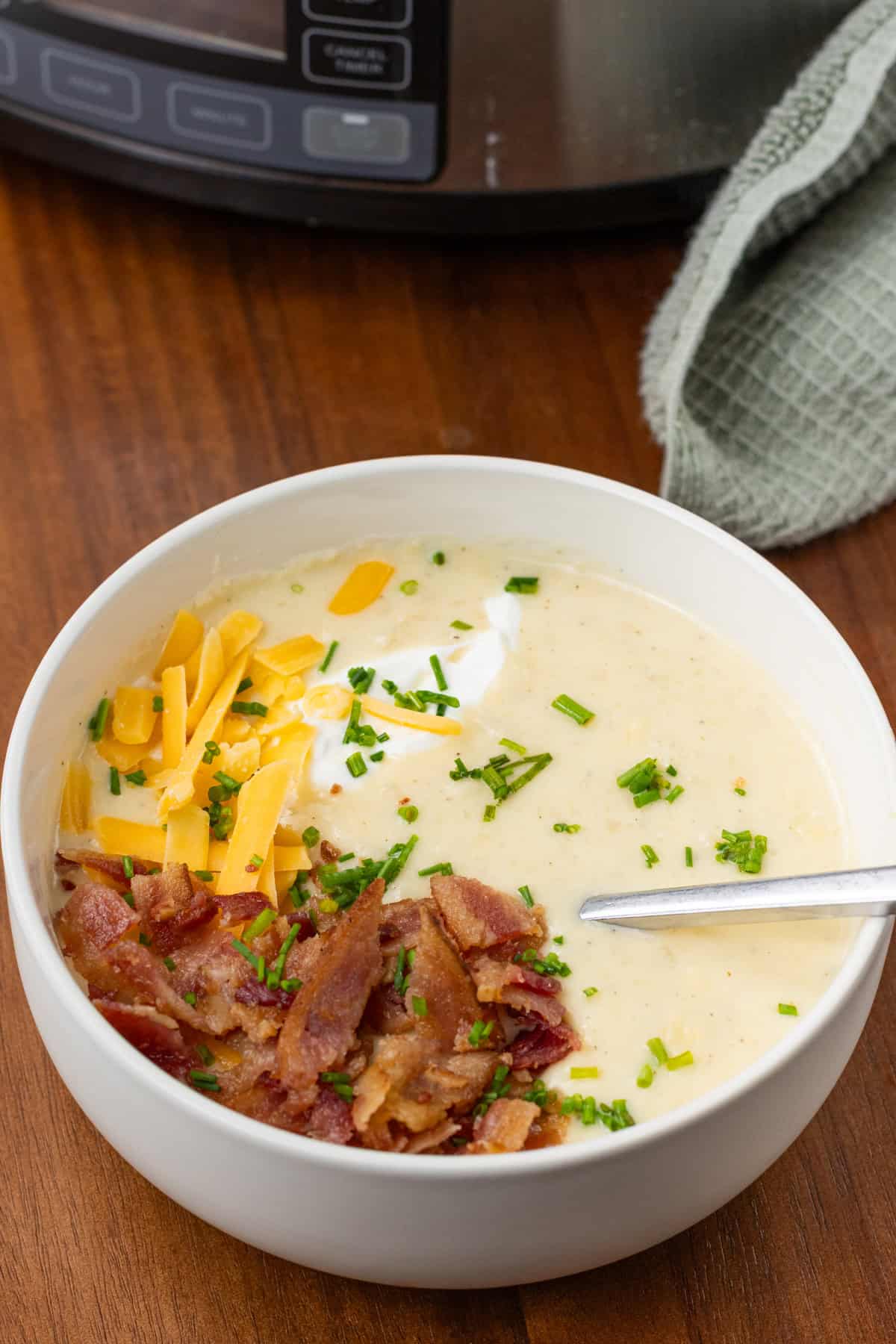 Loaded crock pot potato soup in a bowl