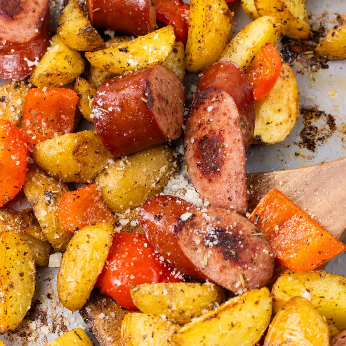 baked potatoes and sausage with parmesan cheese