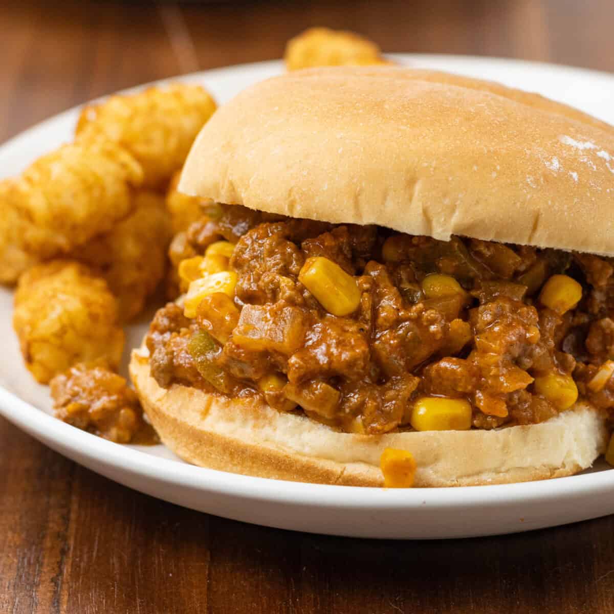 close up of sloppy joes with tater tots on a plate