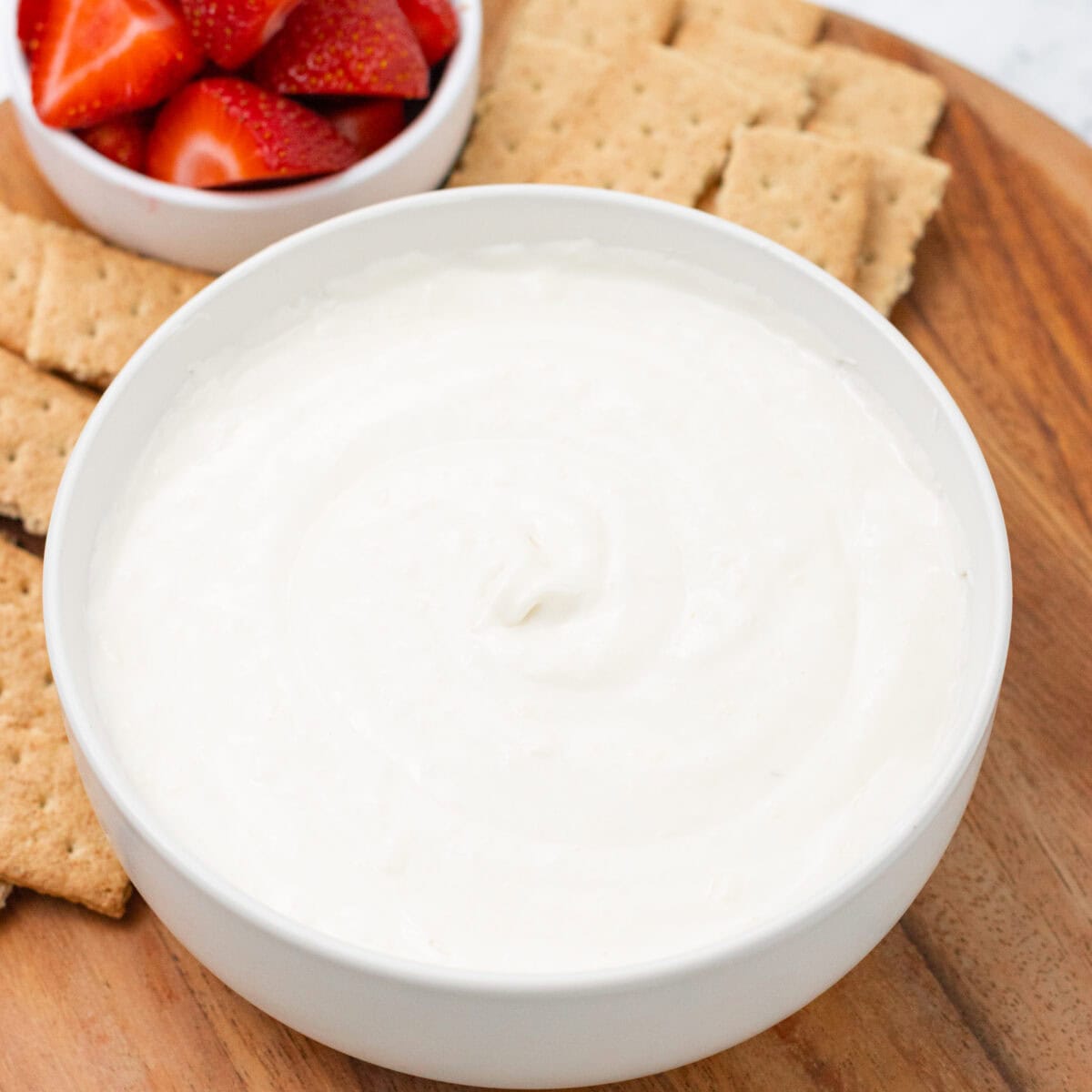 Cheesecake Dip bowled with strawberries and crackers