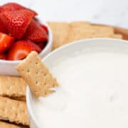 Cheesecake Dip with cracker in bowl