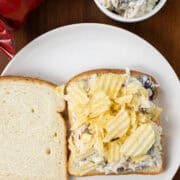 Chicken Salad Sandwich with Chips on a plate with chips bag and chicken salad