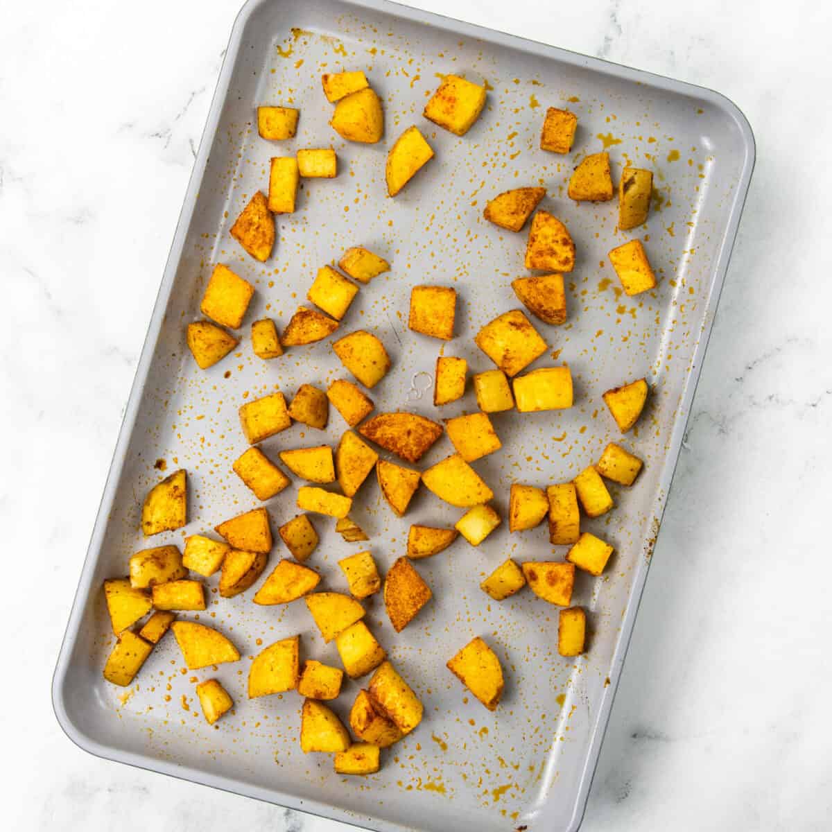 baking potatoes on a pan for Chorizo Potato Egg and Cheese Breakfast Tacos