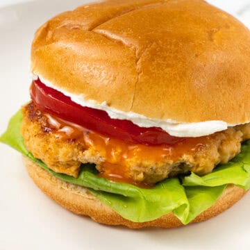 finished burger Buffalo Ground Chicken Burger with Whipped Goat Cheese