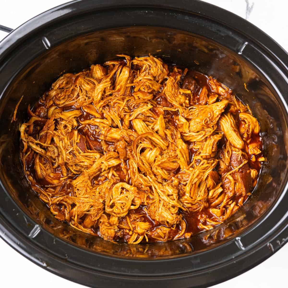 shredded chicken in crockpot with bbq in Slow Cooker BBQ Chicken recipe