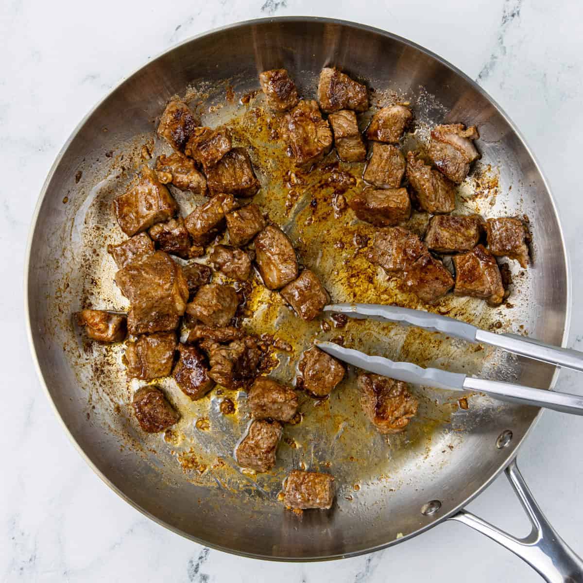 garlic steak bites in pan